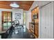 Kitchen area with stainless steel appliances, granite countertops, and wood ceiling at 7875 Robin Rd, Cumming, GA 30041