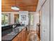 Bright kitchen area with stainless steel appliances, granite countertops, and breakfast bar at 7875 Robin Rd, Cumming, GA 30041