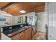 Renovated kitchen featuring granite countertops, stainless steel appliances, and a breakfast bar at 7875 Robin Rd, Cumming, GA 30041