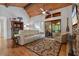 Comfortable living room featuring hardwood floors, stone fireplace, and access to screened in porch at 7875 Robin Rd, Cumming, GA 30041