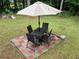Relaxing backyard patio set on brick pavers, perfect for outdoor dining and entertaining at 170 Beatrice St, Dallas, GA 30157