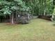 Spacious backyard with a well-maintained lawn and mature trees, offering privacy and ample space for recreation at 170 Beatrice St, Dallas, GA 30157