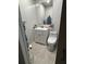 Bathroom with a toilet, vanity, and light wood flooring at 170 Beatrice St, Dallas, GA 30157
