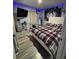 Bedroom featuring a plaid bedspread and sleek flooring at 170 Beatrice St, Dallas, GA 30157