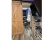 Bedroom with sliding barn door, vanity, and storage; features wood-look flooring at 170 Beatrice St, Dallas, GA 30157