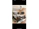 Comfortable bedroom with a ceiling fan and light, wood-look flooring at 170 Beatrice St, Dallas, GA 30157