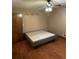 Bedroom with ceiling fan, wood-look flooring, and Live Laugh Love decal at 170 Beatrice St, Dallas, GA 30157