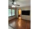 Bedroom featuring a window, hard wood flooring, and doorway leading to an ensuite bathroom at 170 Beatrice St, Dallas, GA 30157