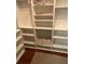 Open closet with multiple shelves and two storage bins at 170 Beatrice St, Dallas, GA 30157