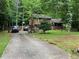 Beautiful two-story home with lush landscaping, a covered porch, a long driveway, and a two-car garage at 170 Beatrice St, Dallas, GA 30157
