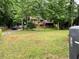 Exterior of a two-story home with a well-manicured front yard and a welcoming porch at 170 Beatrice St, Dallas, GA 30157
