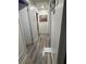 Hallway features gray wood-look floors and freshly painted walls, creating a seamless flow throughout the home at 170 Beatrice St, Dallas, GA 30157
