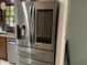 Stainless steel Samsung smart refrigerator with Gathering Hub display; a smart kitchen centerpiece at 170 Beatrice St, Dallas, GA 30157