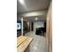 Open kitchen and dining area with stainless steel refrigerator and sliding door access at 170 Beatrice St, Dallas, GA 30157
