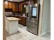 Well-equipped kitchen featuring wood cabinets, island and stainless steel appliances at 170 Beatrice St, Dallas, GA 30157