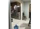 A view of the kitchen with stainless steel appliances and light gray wood-style floors at 170 Beatrice St, Dallas, GA 30157