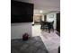A view of the living room with a shaggy rug, TV, and an adjacent dining area at 170 Beatrice St, Dallas, GA 30157