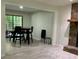 Open-concept living room with stone fireplace and sliding glass doors at 170 Beatrice St, Dallas, GA 30157