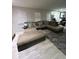 Spacious living room featuring neutral colored walls, sectional couch, and plush rug at 170 Beatrice St, Dallas, GA 30157