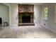 Bright living room with stone fireplace and light woodgrain flooring at 170 Beatrice St, Dallas, GA 30157