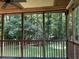 View from the screened-in porch of the backyard and trees at 170 Beatrice St, Dallas, GA 30157