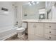 All-white bathroom with a bathtub, shower, toilet, vanity and mirror at 2901 Lenox Rd # 702, Atlanta, GA 30324