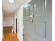 Inviting entryway showcasing the front door with unit number and hardwood floors at 2901 Lenox Rd # 702, Atlanta, GA 30324