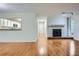 Inviting living area with hardwood floors, fireplace, and open view to the kitchen at 2901 Lenox Rd # 702, Atlanta, GA 30324