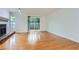 Well-lit living room boasts hardwood floors, a fireplace, and access to a patio through sliding doors at 2901 Lenox Rd # 702, Atlanta, GA 30324