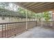 Cozy covered patio with fence views and tranquil outdoor space at 2901 Lenox Rd # 702, Atlanta, GA 30324