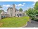 Manicured backyard with lush green grass, patio area, and privacy fence, perfect for outdoor enjoyment at 3816 Harris Nw Blvd, Kennesaw, GA 30144