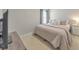 Bedroom with an off-white bed, neutral walls, and a mounted TV at 3816 Harris Nw Blvd, Kennesaw, GA 30144