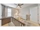 Bedroom with a crib, white armchair, dresser, and a ceiling fan at 3816 Harris Nw Blvd, Kennesaw, GA 30144