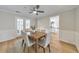 Traditional dining room features wainscoting, a ceiling fan, and access to the backyard at 3816 Harris Nw Blvd, Kennesaw, GA 30144