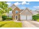 Charming two-story home featuring a stone facade, well-manicured lawn, and a two-car garage at 3816 Harris Nw Blvd, Kennesaw, GA 30144