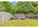 Cozy backyard fire pit area with chairs, ideal for gatherings and enjoying outdoor evenings at 3816 Harris Nw Blvd, Kennesaw, GA 30144