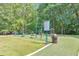 Outdoor exercise area with various equipment in the Legacy Park Community surrounded by mature trees at 3816 Harris Nw Blvd, Kennesaw, GA 30144