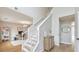 Inviting foyer featuring hardwood floors, a staircase, and neutral decor at 3816 Harris Nw Blvd, Kennesaw, GA 30144