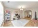 Bright living room features a home office and a view into the dining room at 3816 Harris Nw Blvd, Kennesaw, GA 30144