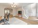 Open-concept living space with hardwood floors, a staircase, and a view into the dining room at 3816 Harris Nw Blvd, Kennesaw, GA 30144
