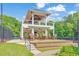 Two story community outdoor pavillion with tables, chairs, and ceiling fans in the Legacy Park community at 3816 Harris Nw Blvd, Kennesaw, GA 30144