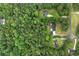 A bird's eye view of homes surrounded by a canopy of lush green trees in a private, wooded setting at 4274 Timber Trace Road, Loganville, GA 30052