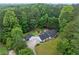 A beautiful home nestled in a lush forest setting offers privacy and stunning natural beauty at 4274 Timber Trace Road, Loganville, GA 30052