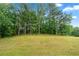 Large, expansive backyard provides ample space for outdoor activities and relaxation at 4274 Timber Trace Road, Loganville, GA 30052