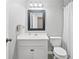 Cozy bathroom featuring a white vanity, toilet, and shower with neutral accents at 4274 Timber Trace Road, Loganville, GA 30052
