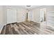 A well lit bedroom with hardwood floors, closet, and an adjacent bathroom at 4274 Timber Trace Road, Loganville, GA 30052