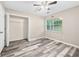 Well-lit bedroom with a large window, ceiling fan, and closet for ample storage at 4274 Timber Trace Road, Loganville, GA 30052