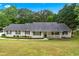 Charming ranch-style home with a well-manicured lawn and inviting front porch at 4274 Timber Trace Road, Loganville, GA 30052