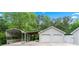Two-car garage with additional carport provides ample covered parking at 4274 Timber Trace Road, Loganville, GA 30052