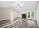 Large living room with stone fireplace, ceiling fan and access to the back patio at 4274 Timber Trace Road, Loganville, GA 30052